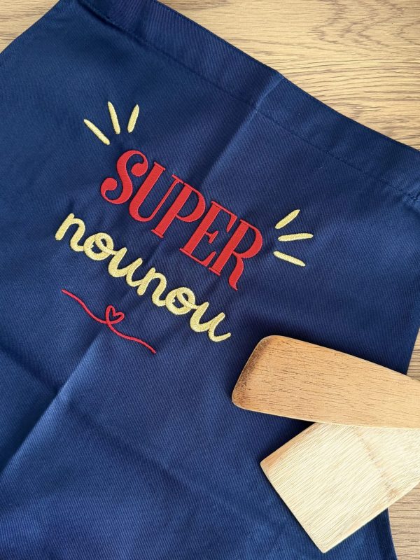 Tablier de cuisine bleu marine brodé "Super Nounou"